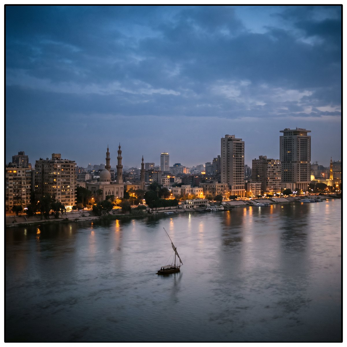 Cairo skyline over the Nile at blue hour